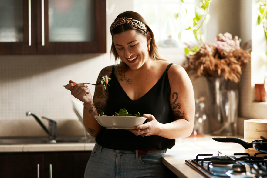 Ozempic vs Wegovy: a woman eating a salad.
