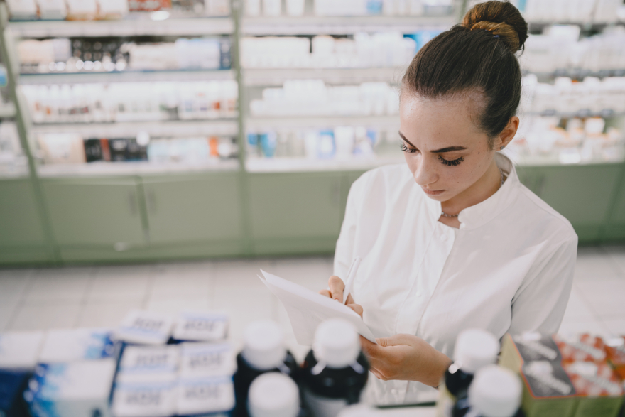 Ozempic vs Wegovy: a woman working in a pharmacy.
