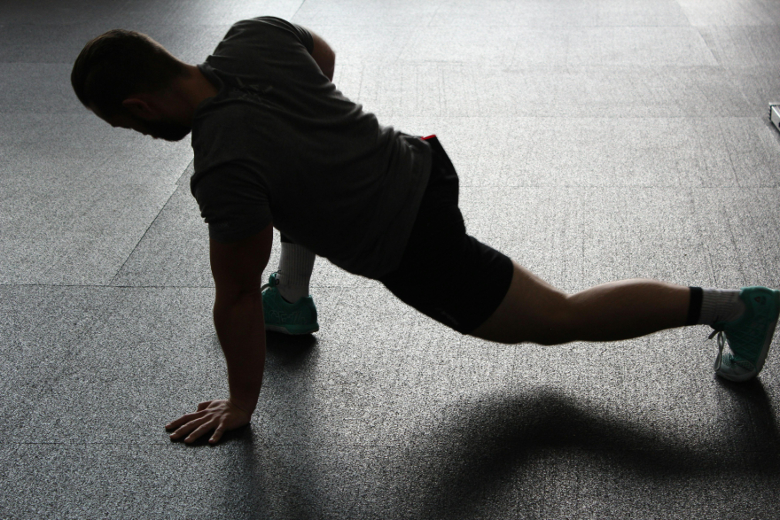 Sauna benefits: a man stretching.