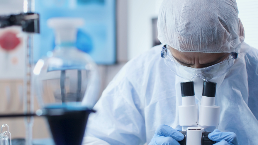 Side effects of Mounjaro: a researcher working in a lab.